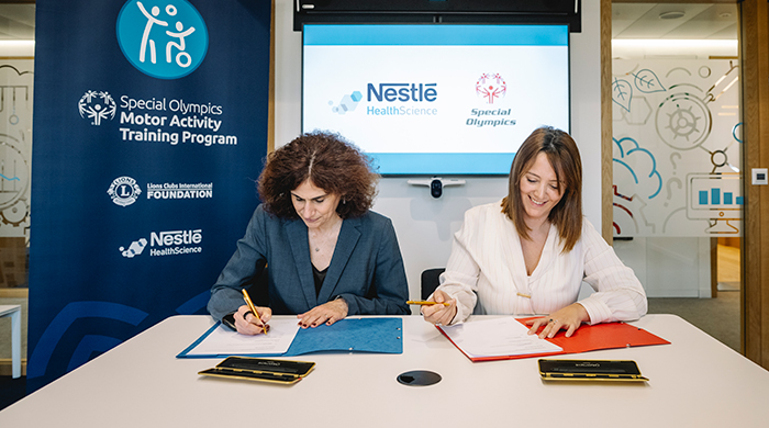 Two women sitting at the desk