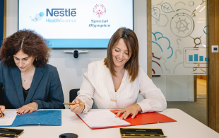 Two women sitting at the desk