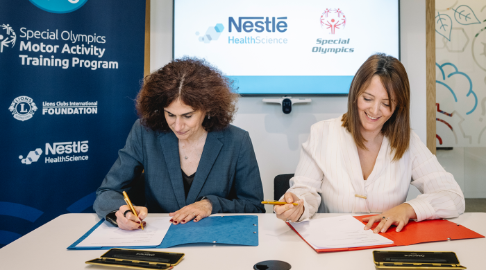 Two women sitting at the desk